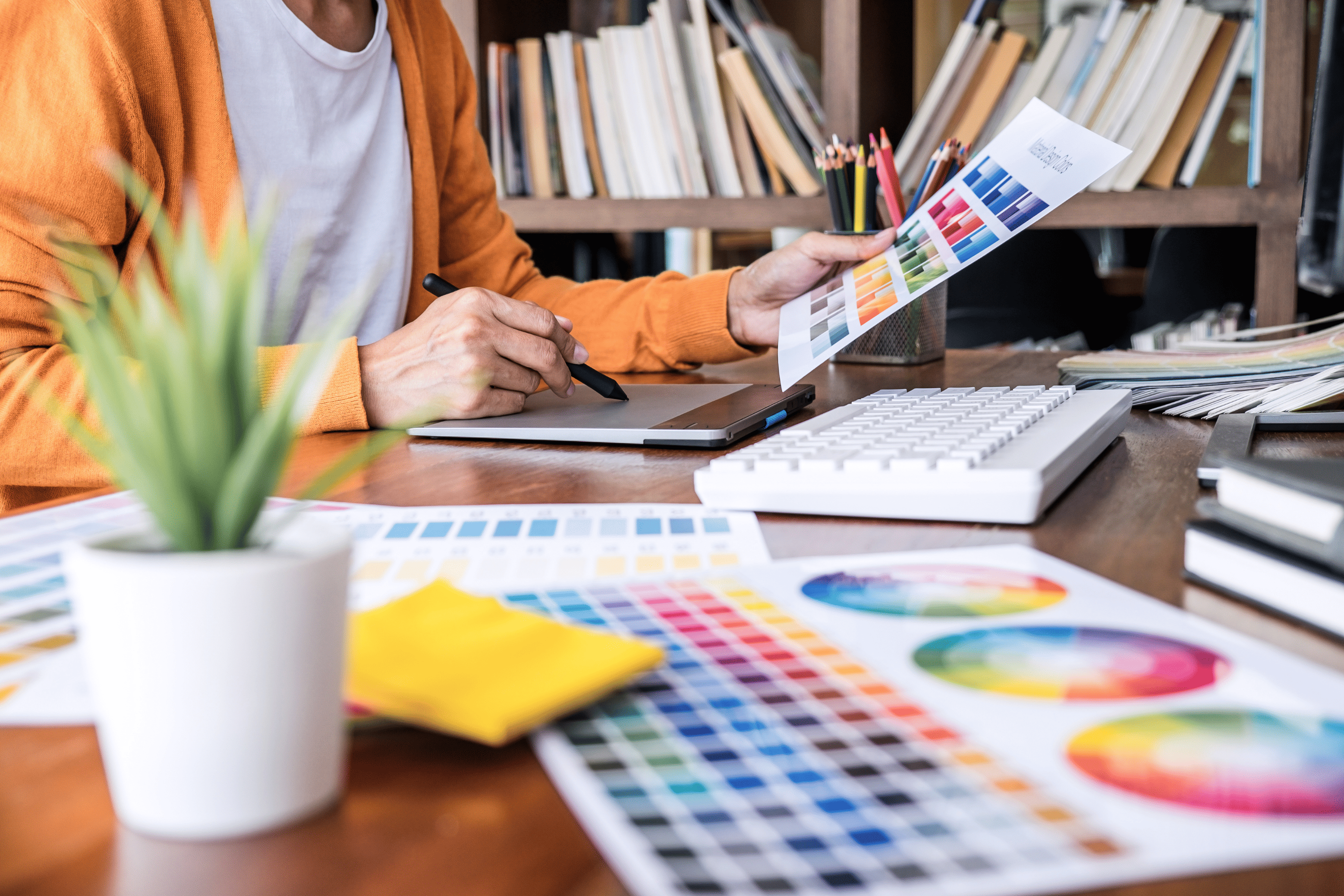 designer holding color charts